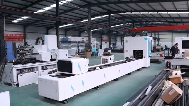 An industrial factory interior showcasing advanced CNC machines with no people in view.
