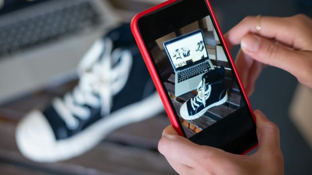 Capturing sneakers with a mobile phone for an online store showcase. E-commerce at its best.