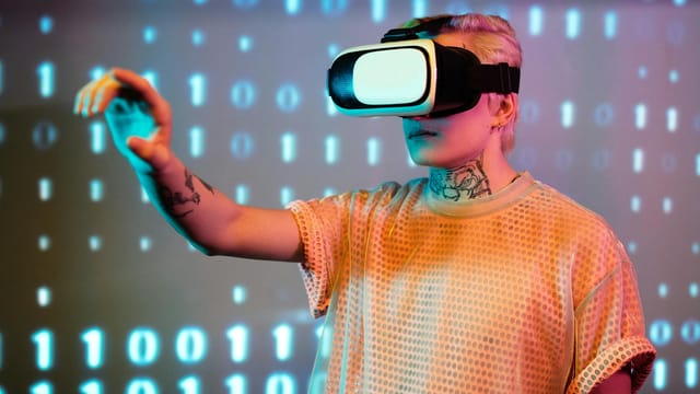 A person experiences virtual reality with a headset against a background of binary code.