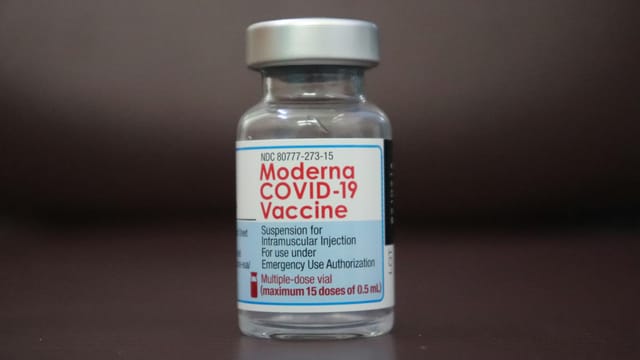 Close-up of a Moderna COVID-19 vaccine vial for emergency use authorization.