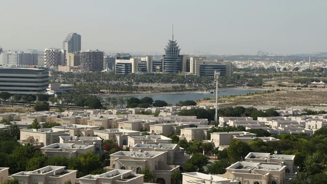 A scenic aerial view of Dubai Silicon Oasis with modern architecture and lush greenery.