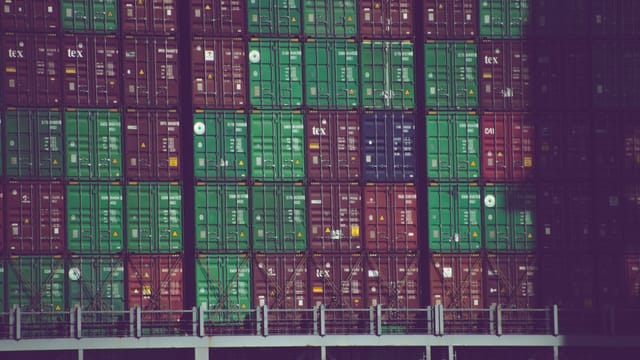 Illustrative image: Vibrant cargo containers stacked at Hamburg port, Germany, showcasing global trade.
