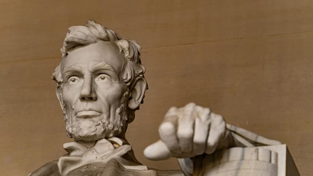 Detailed view of the Lincoln Memorial in Washington D.C., capturing the iconic statue's expression and posture.