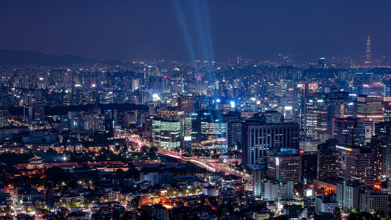 A breathtaking aerial view of a vibrant city illuminated at night.