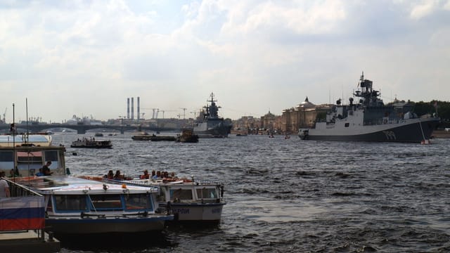 Scenic view of naval ships and boats on the Neva River in St. Petersburg, Russia.