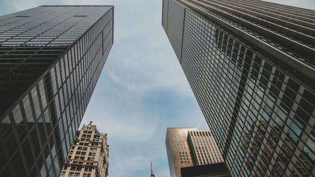 High-rise buildings forming a captivating urban skyline under a clear blue sky.