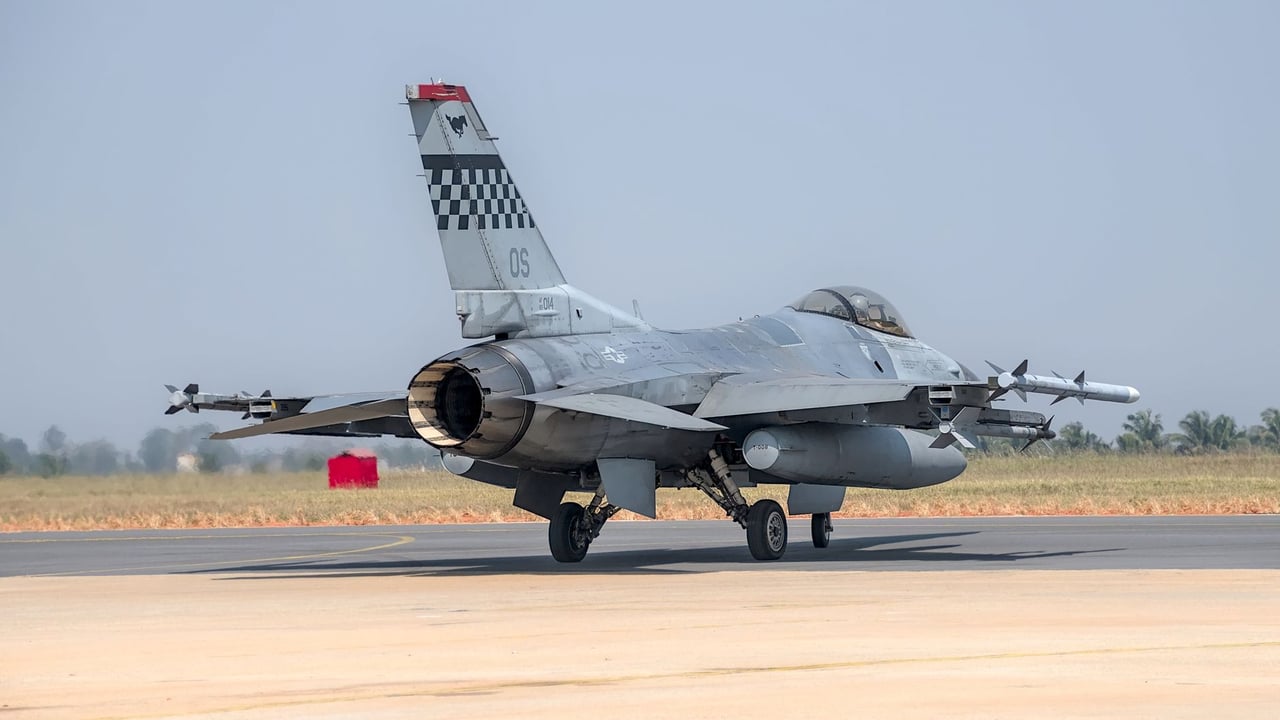 F-16 fighter jet preparing for takeoff at Bengaluru air show.