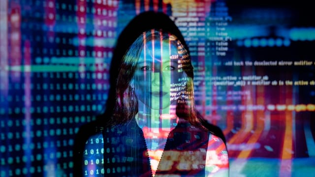 A woman with digital code projections on her face, representing technology and future concepts.