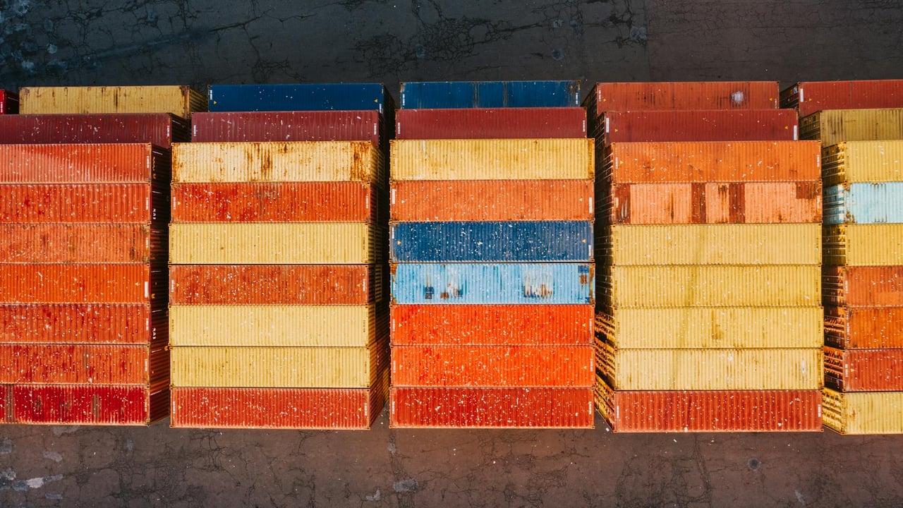 Top view of stacked colorful shipping containers in Philadelphia port.