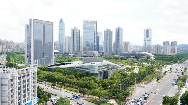Aerial view of Huizhou cityscape with modern skyscrapers and vibrant urban landscape.