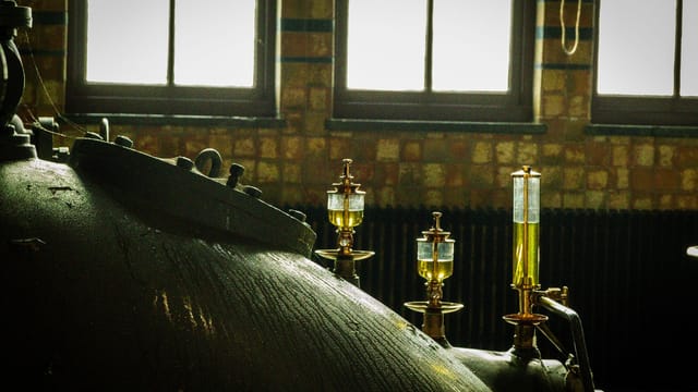 Close-up of vintage industrial machinery in an old factory setting.
