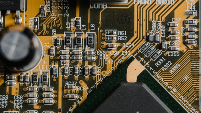 High-resolution close-up of a circuit board showing intricate electronic components and pathways.