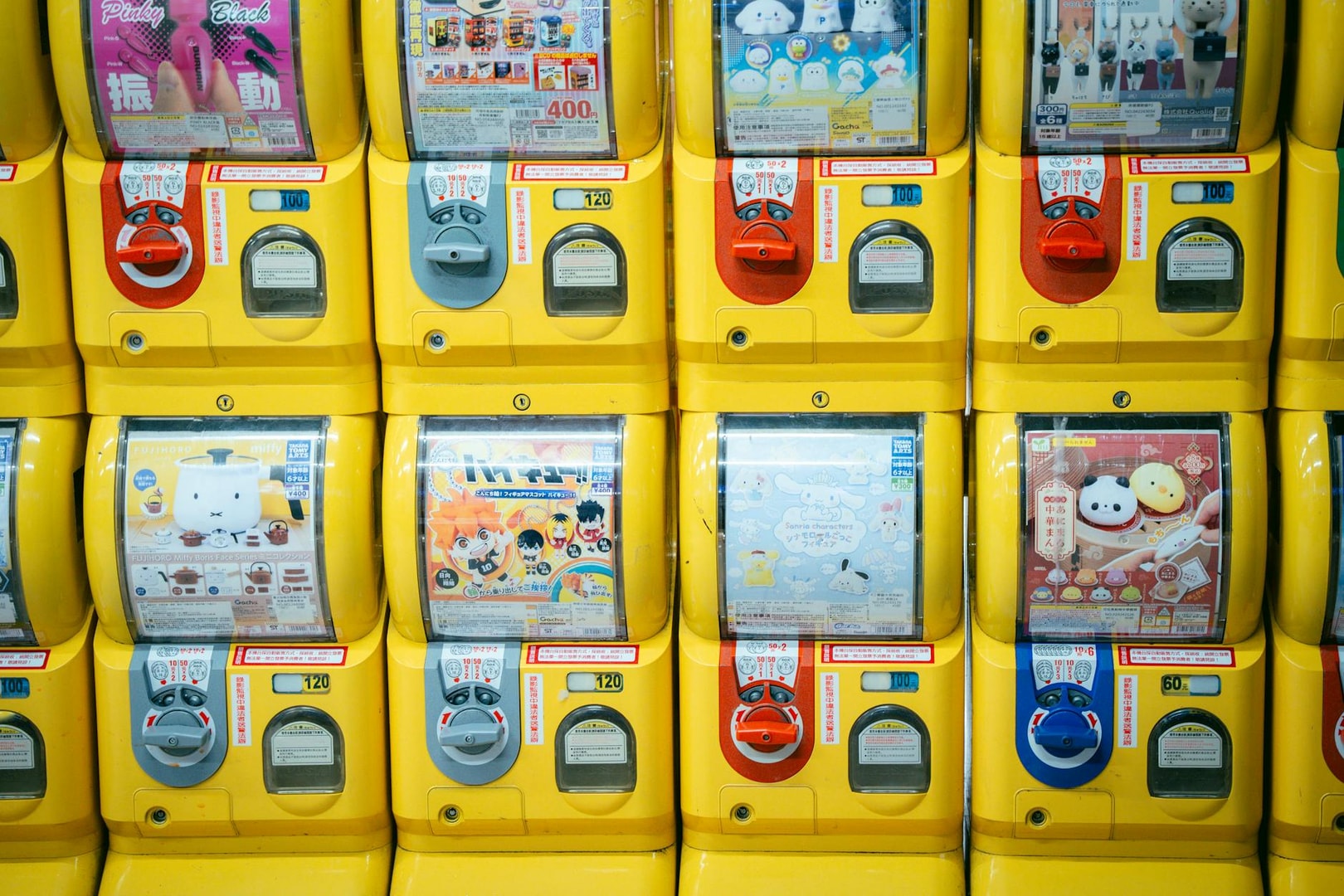 Rows of vibrant gashapon vending machines filled with toys in Taiwan.