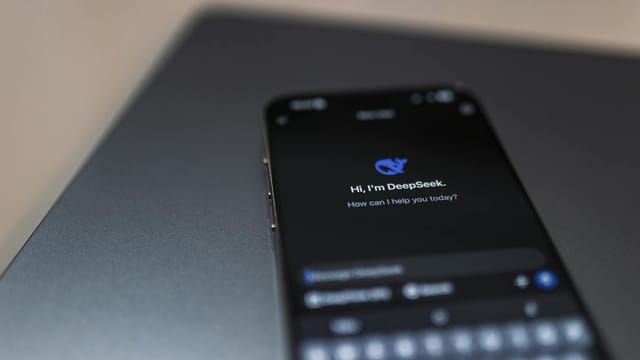 Close-up of a smartphone displaying an AI chat interface with the DeepSeek app.