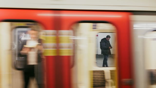 Illustrative image: Urban subway scene with motion blur capturing daily commuting life.