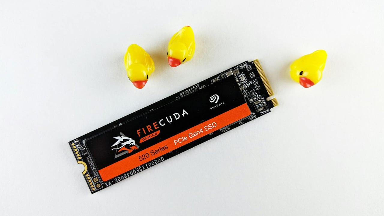 Close-up of a Seagate FireCuda SSD on a white background with three yellow rubber ducks.