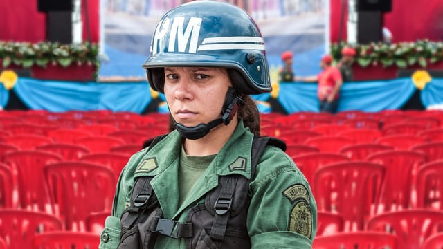 Woman of Bolivarian Armed Forces in a presidential meeting