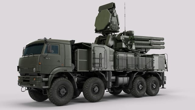 High-resolution image of a military anti-aircraft vehicle in a studio setting.