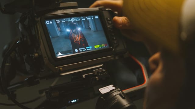 Capturing a cinematic scene with professional video camera equipment indoors.