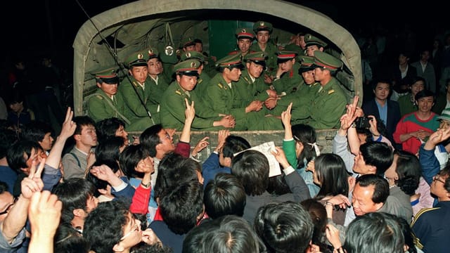 Red Army soldiers in a transport arrive at Tiananmen Square during the protests of 1989