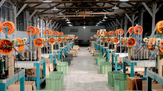 Illustrative image: Spacious industrial hall with machinery and equipment for manufacturing. Ideal stock image for industry themes.