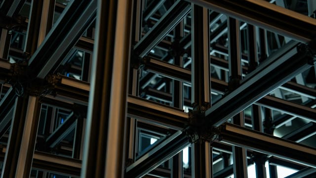 Intricate steel lattice structure showcasing modern geometric industrial design.