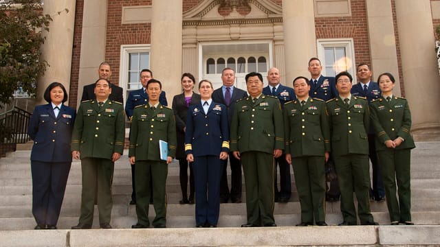 Members of the U.S. Coast Guard Academy and Chinese Maritime Police Academy pose for a photograph