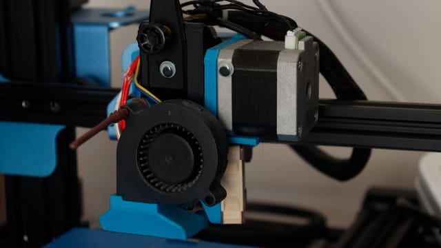 Detailed view of a 3D printer component showcasing its technology and design.