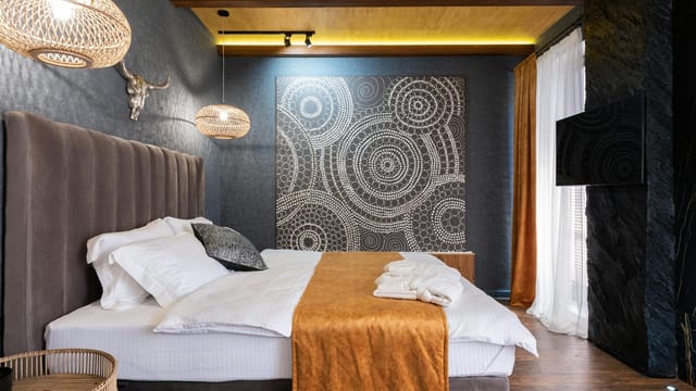 Stylish modern bedroom design featuring warm lighting and unique decor elements.