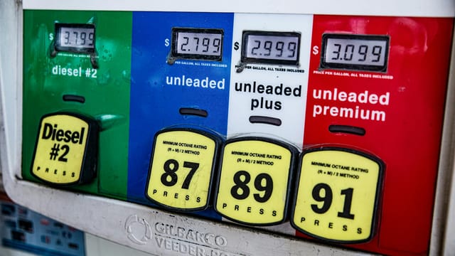 Close-up of a vintage gas pump station showing fuel prices and octane ratings in Los Angeles.