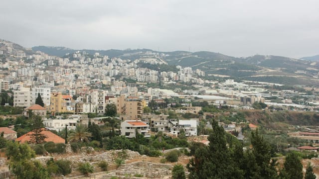Hillside view of Byblos showcasing urban cityscape and natural landscape in Lebanon.