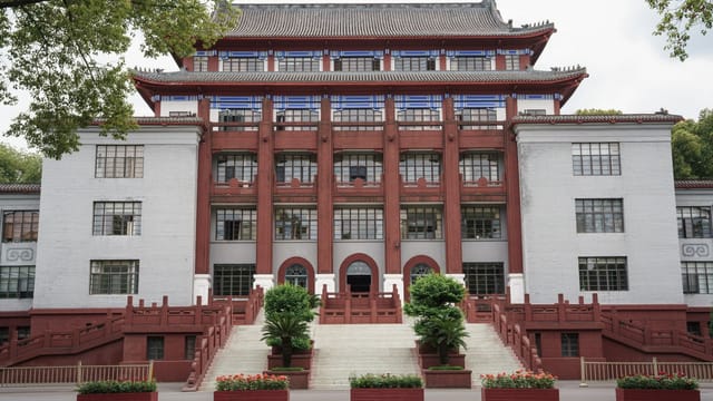 Front view of a traditional building at Sichuan University in Chengdu, showcasing distinct architectural features.