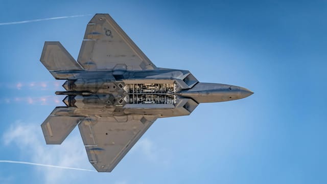 Dynamic shot of the F-22 Raptor flying at high speed during the Miramar Airshow in San Diego.