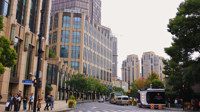 View of modern buildings and streets in Shanghai, China, showcasing urban architecture.