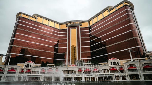 Front view of Wynn Palace Hotel, Macau with its distinctive modern architecture and elegant water fountains.