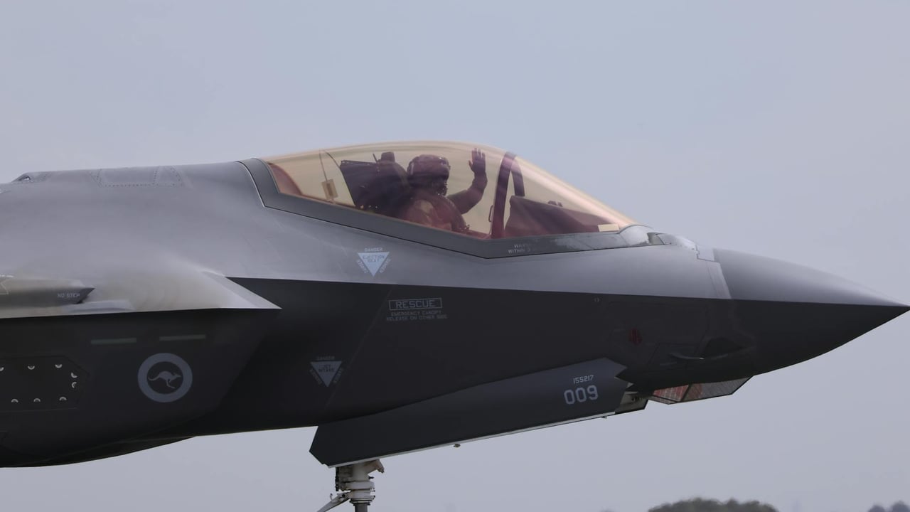 Close-up of an F-35 fighter jet with a pilot waving, captured at Geelong, VIC.