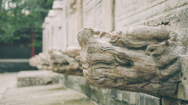 Close-up of dragon stone sculpture at a historic site in Jining, Shandong Province, China.