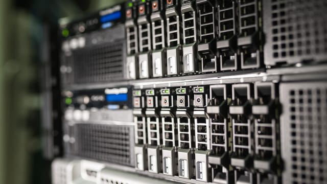Illustrative image: Close-up of server equipment in a modern data center highlighting technology infrastructure.