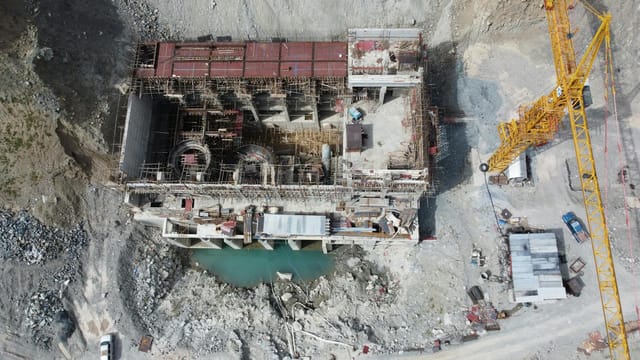 Aerial drone shot of an unfinished construction site in Kalam, Pakistan.