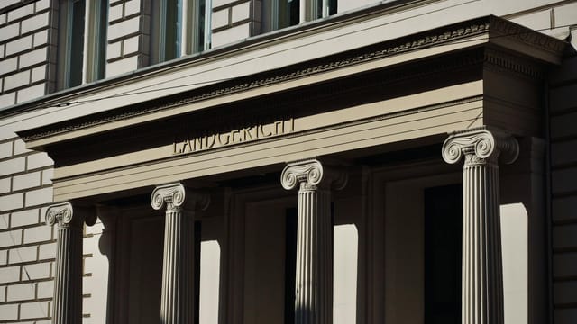 Majestic Neoclassical facade featuring ornate columns and classical architecture.