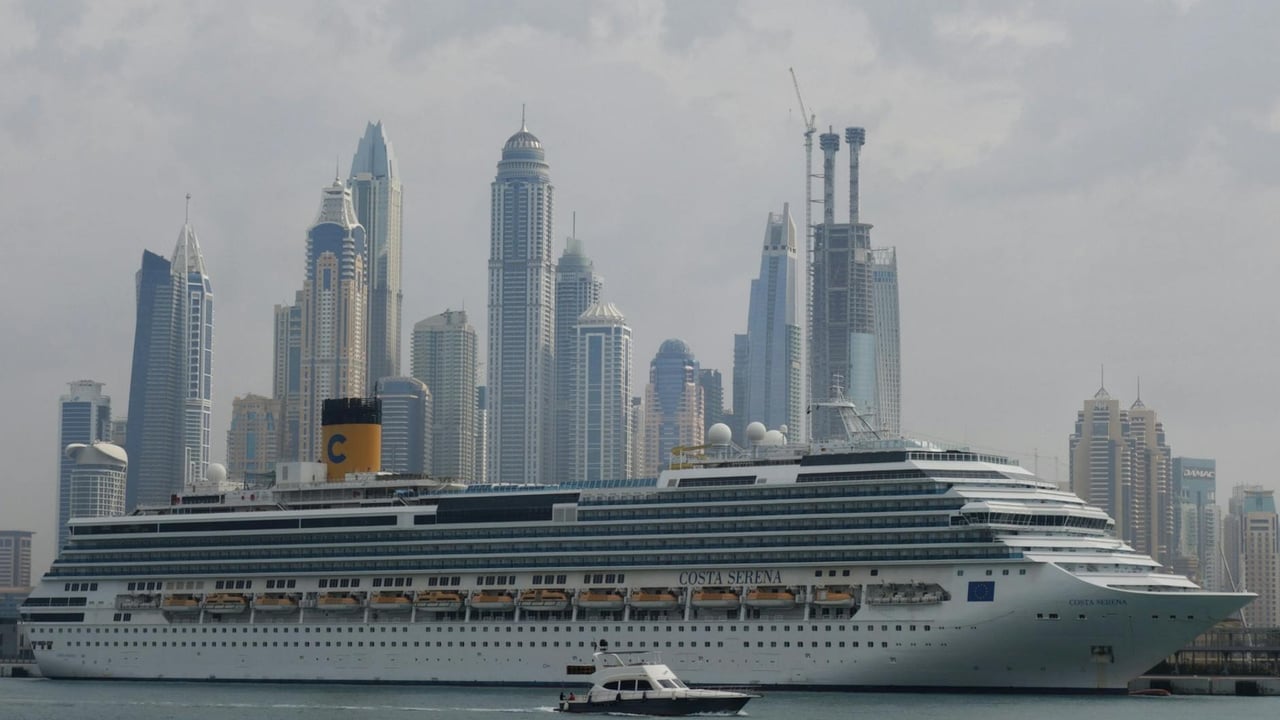 Cruise ship sailing near a modern skyscraper city skyline, an elegant blend of travel and architecture.