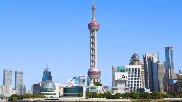 Stunning daytime view of Shanghai's iconic skyline with the Oriental Pearl Tower.