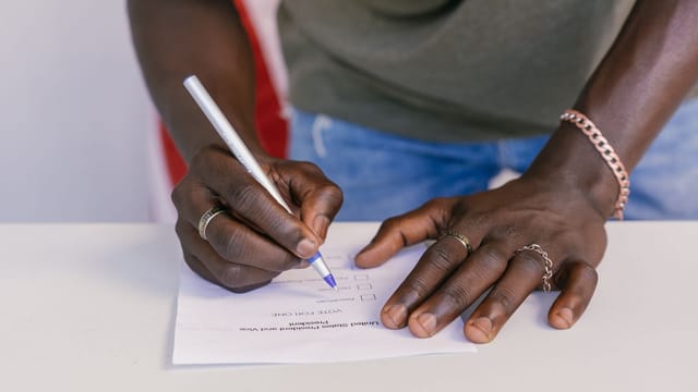 Illustrative image: A close-up of a person marking a ballot paper during an election.