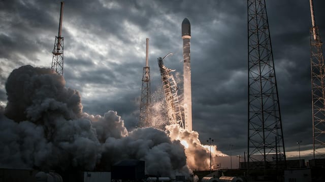 Smoke billows as a rocket launches into a dramatic evening sky, showcasing technological innovation.