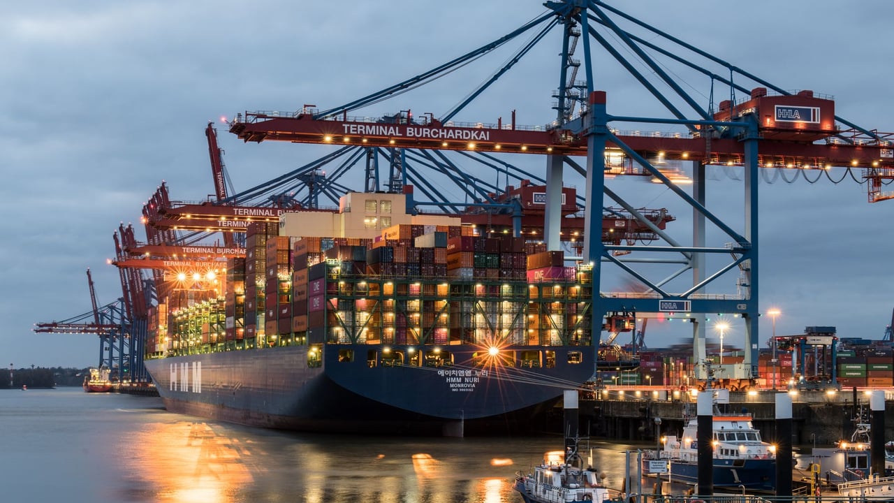 Illustrative image: Container ships moored at Terminal Burchardkai in Hamburg, Germany during evening hours.