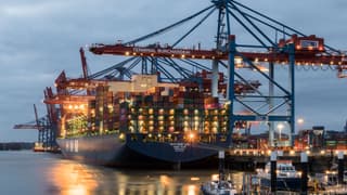 Illustrative image: Container ships moored at Terminal Burchardkai in Hamburg, Germany during evening hours.