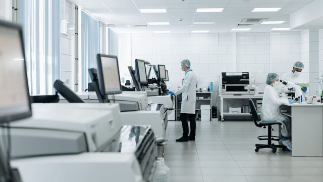 Scientists conducting research in a state-of-the-art laboratory with advanced equipment.