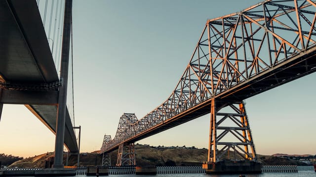 A stunning view of the Carquinez Strait Bridges in Crockett, California at sunset.