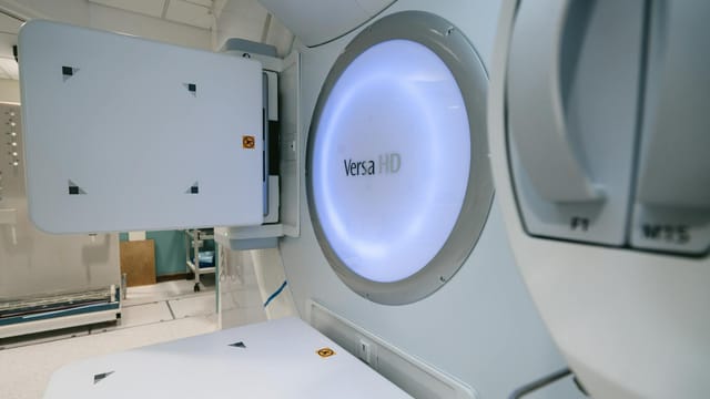 Close-up of Versa HD radiotherapy machine in a clinical setting.