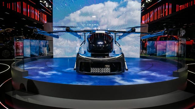Flying car exhibit at automotive event in São Paulo showcasing innovation in transport technology.